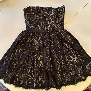 Black lace party dress. Size 4, in good condition.